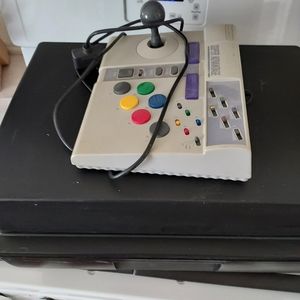 Super NES game console with carrying case and four game and two remotes